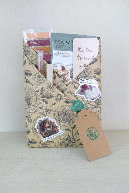 Surprise wrapped book with black and white roses – paranormal mystery | The Story Grove