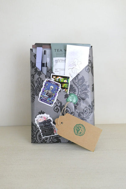 Surprise wrapped book in gothic black ornate wrapping – suspense thriller | The Story Grove