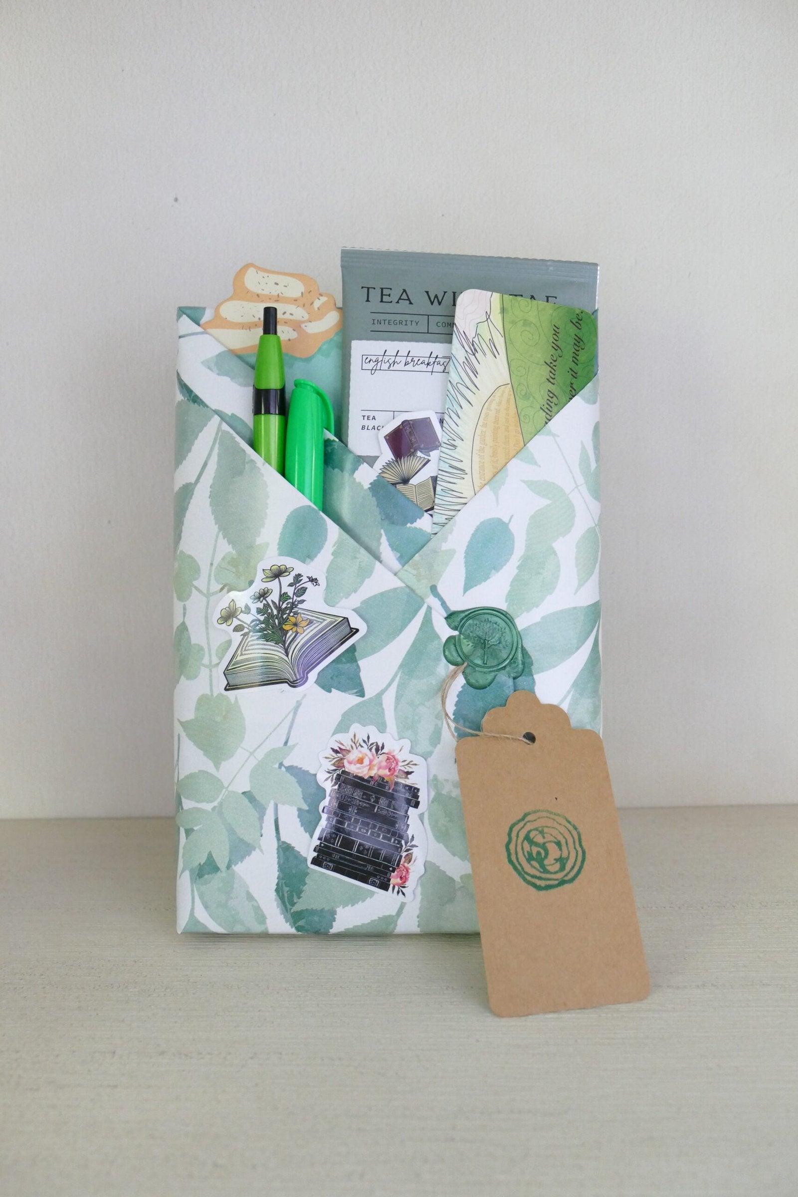 Surprise wrapped book with green leaf design – YA fantasy | The Story Grove